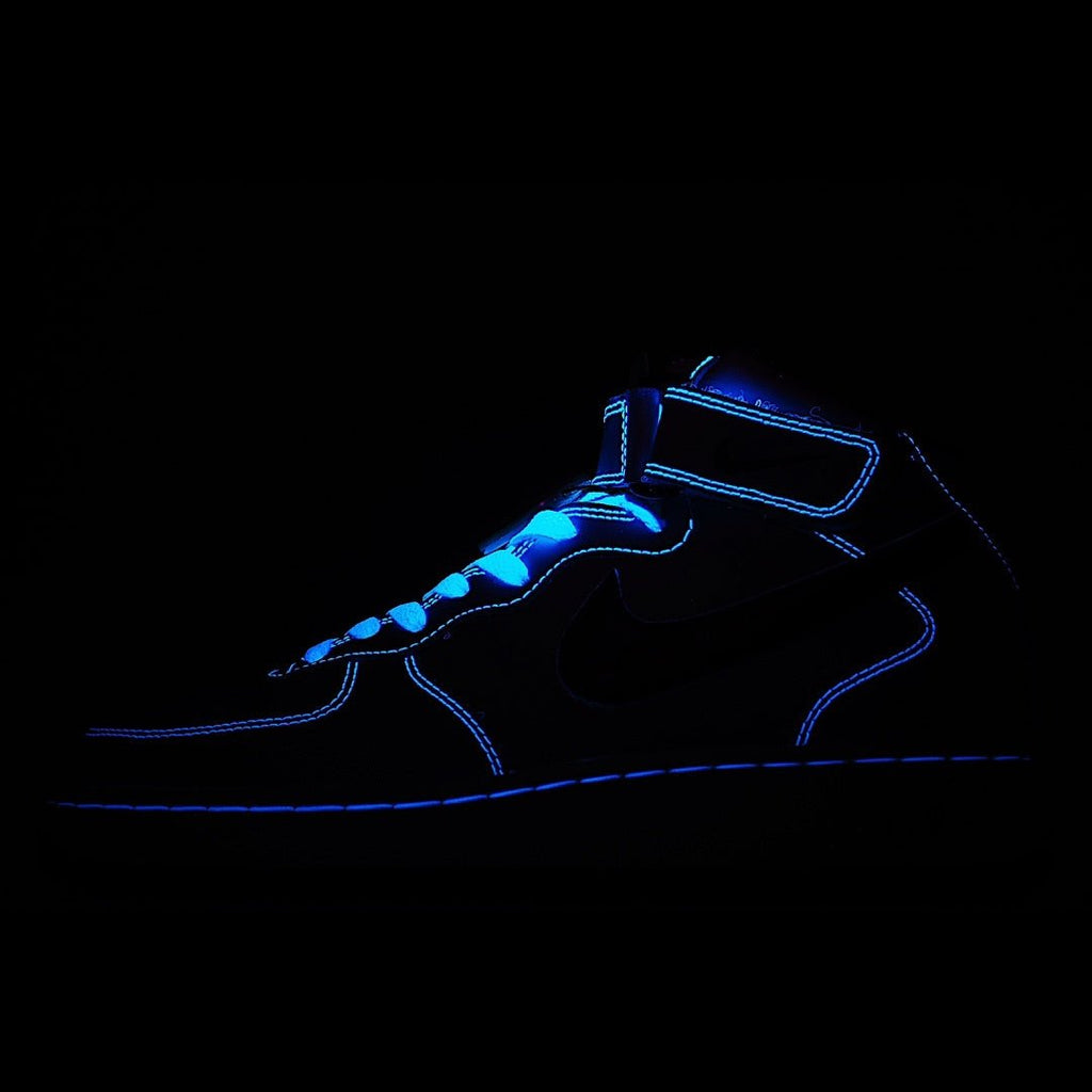 Dark blue and black high-top sneakers with neon blue outline and swoosh detail