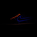 Nike Air Force 1 sneaker with dark blue upper and orange laces