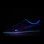 Dark blue Nike Air Force 1 sneakers with glowing blue accents