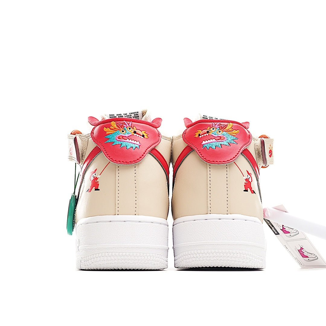 Back view of cream high-top sneakers with red heel patches and floral details