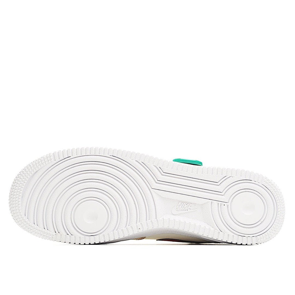 White rubber sneaker outsole with tread pattern and small green accent