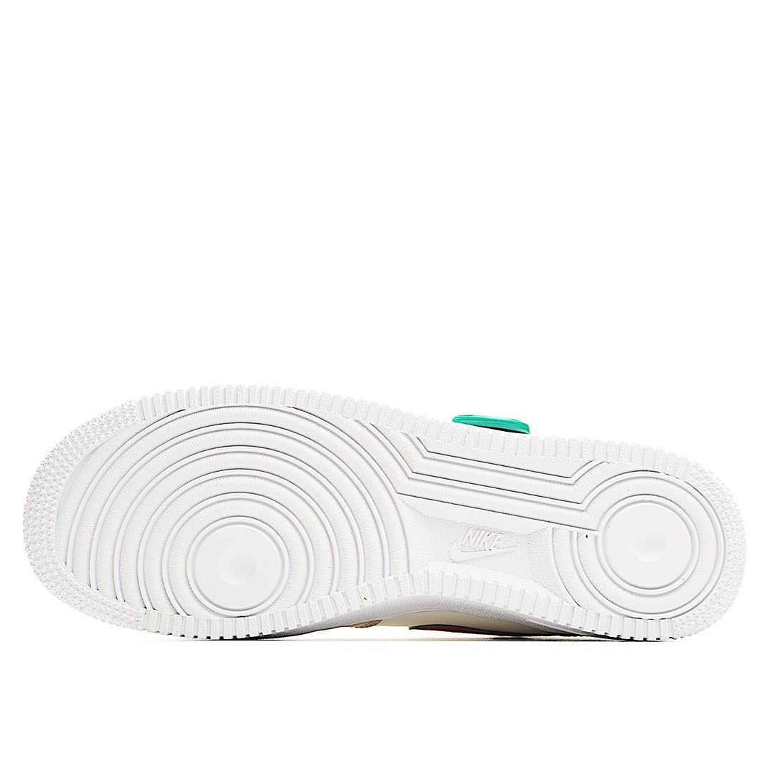 White rubber sneaker outsole with tread pattern and small green accent