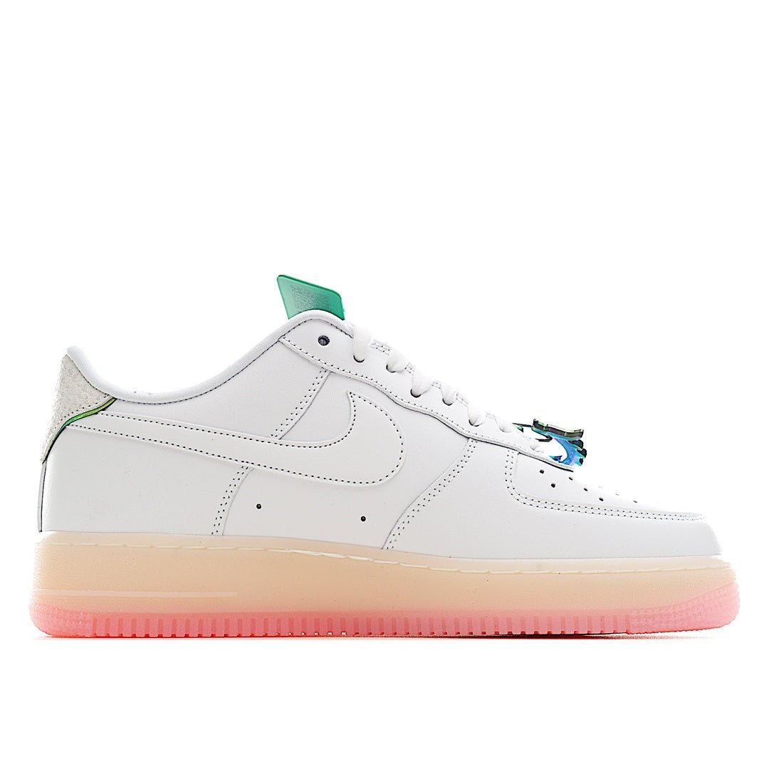 White low-top sneaker profile with black swoosh, green heel tab, and pink rubber sole