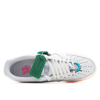 White low-top sneaker interior lining view with white laces and green tag