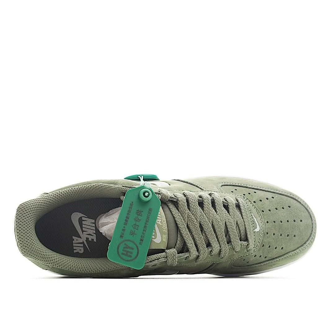Olive suede sneaker with teal pull tab, open toe view, and Air logo inside