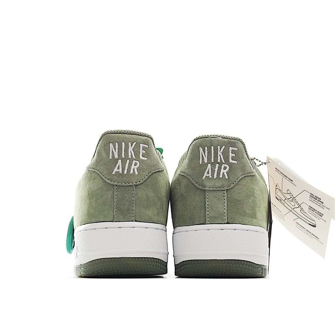 Olive suede Nike Air heel sneakers with white midsole and teal heel accents