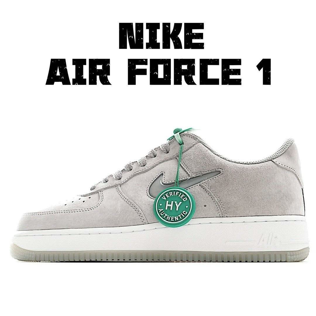 Nike Air Force 1 low-top sneakers, light gray suede with teal laces and white rubber sole