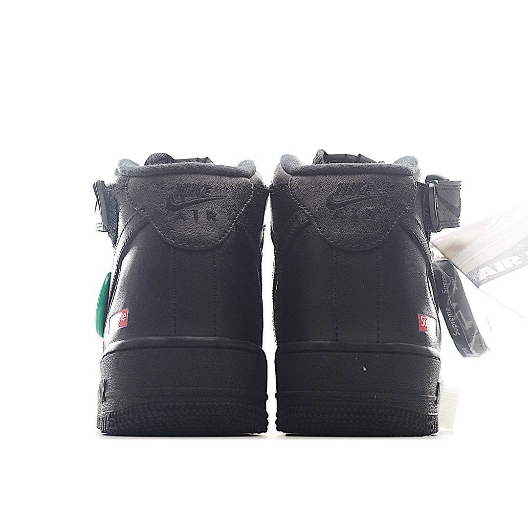 Pair of black high-top sneakers, back view with heel tabs and Air-branded heel