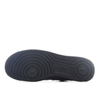 Rubber outsole for a dark gray/black high-top sneaker with circular tread pattern