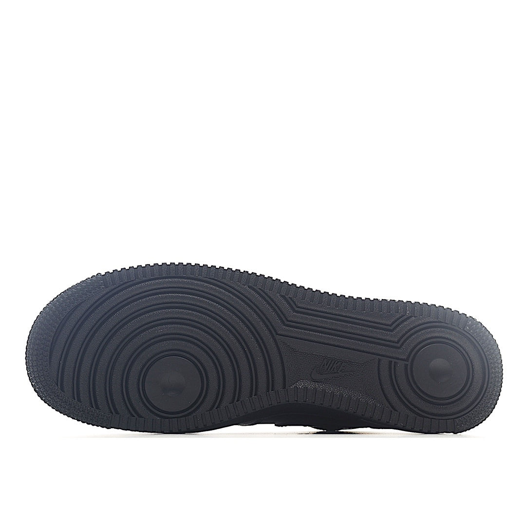 Rubber outsole for a dark gray/black high-top sneaker with circular tread pattern