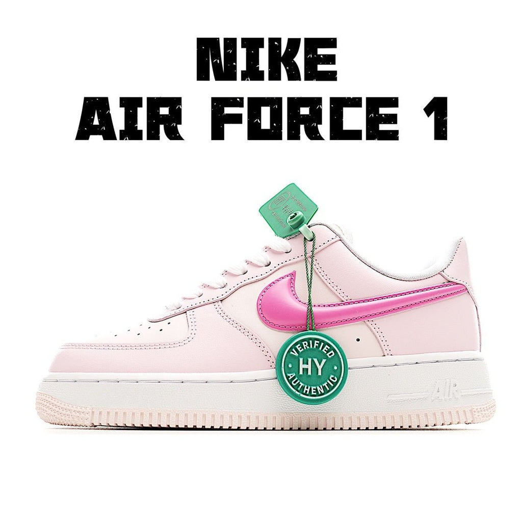 Pink and white low-top sneakers with pink swoosh and green tag
