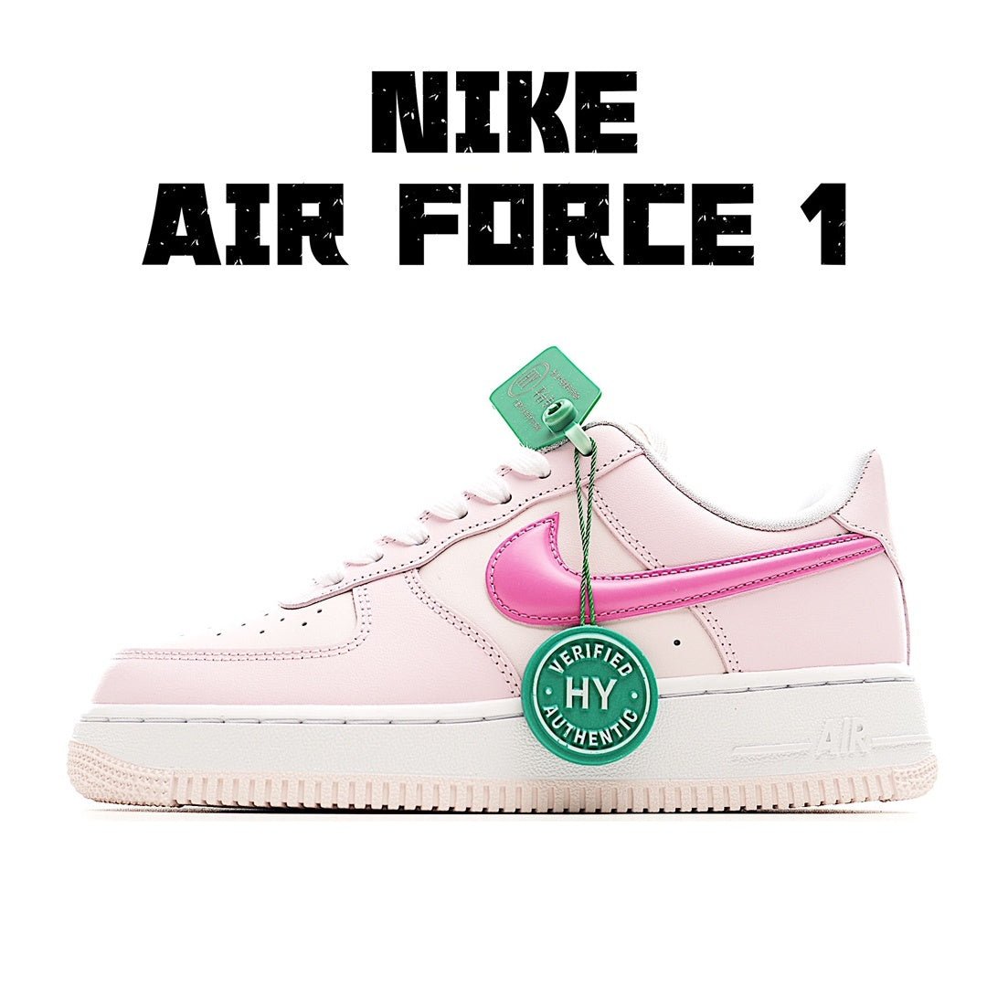 Pink and white low-top sneakers with pink swoosh and green tag