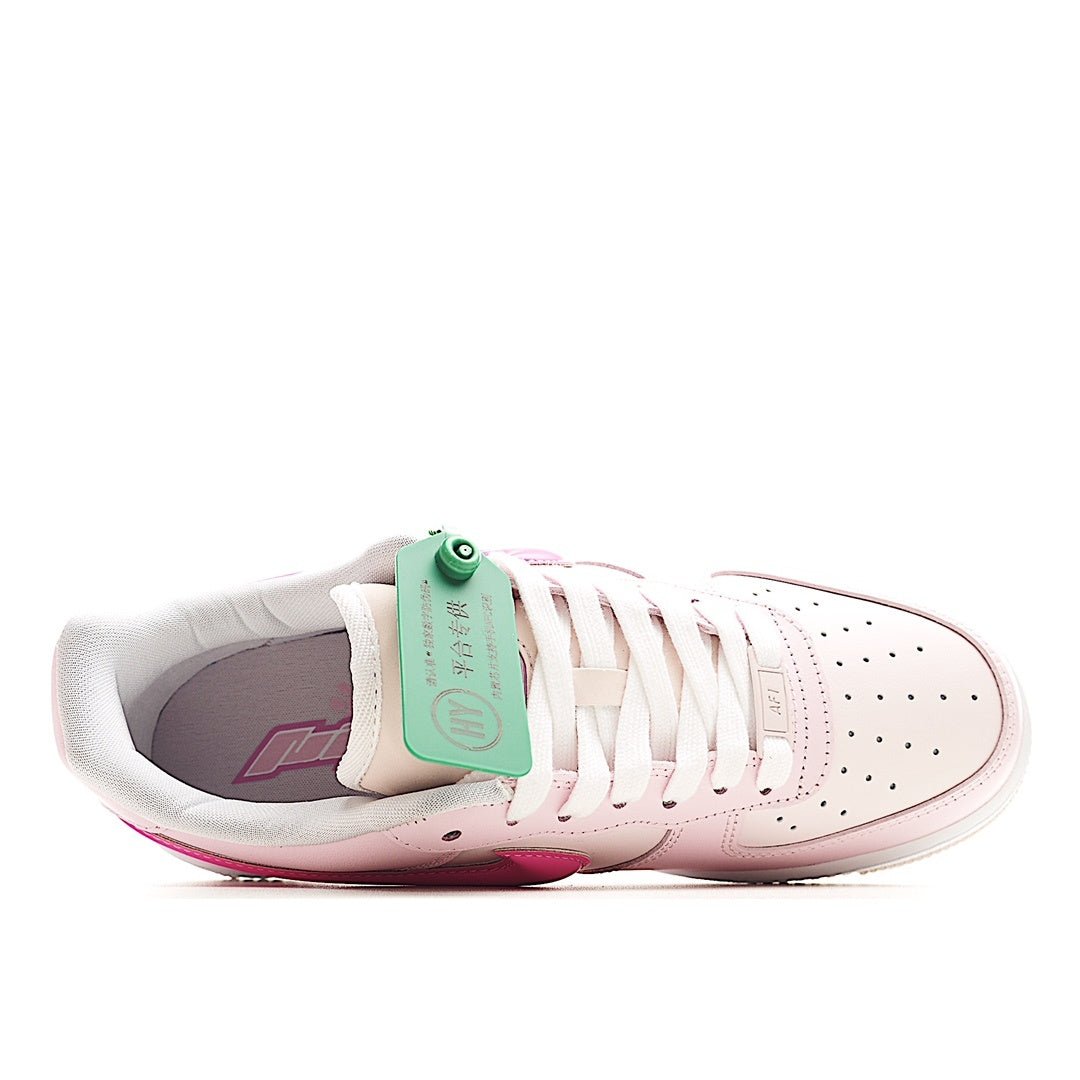 Pink and white low-top sneakers, inner lining and green hang tag visible