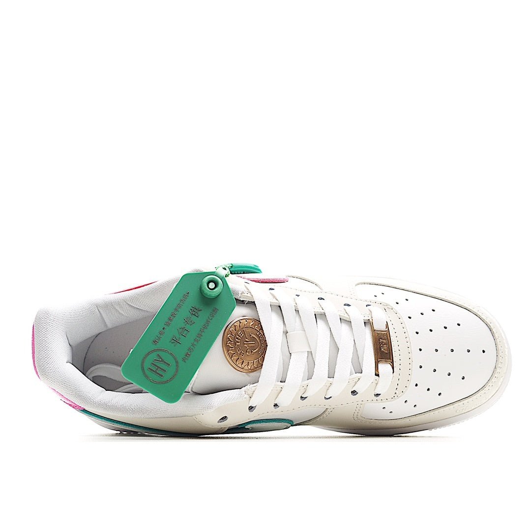 White low-top sneaker with green interior lining and lace-up tongue tag