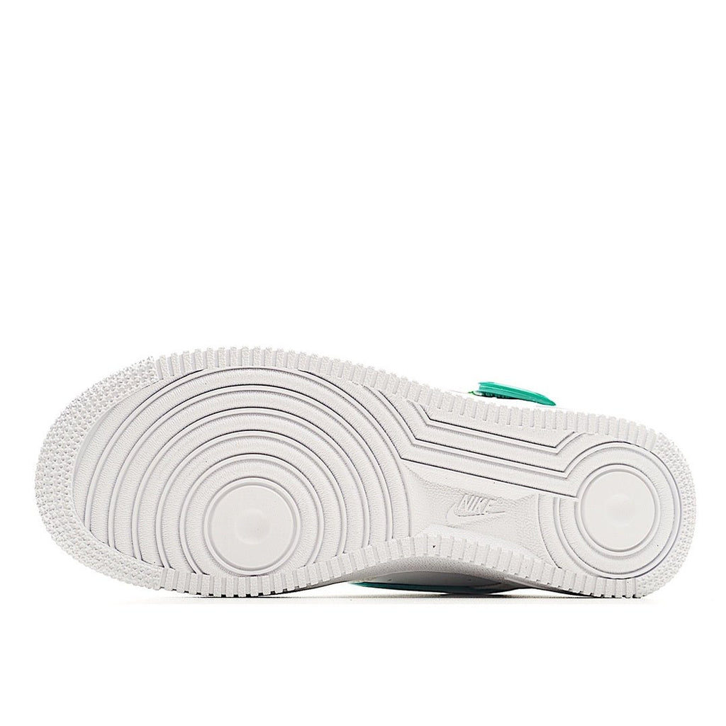 White rubber outsole for low-top sneaker with tread pattern and teal heel