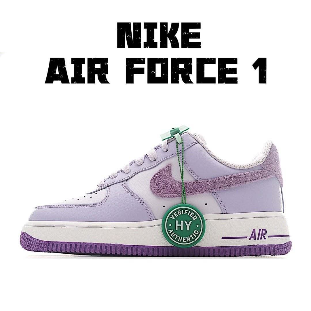 Lavender Nike Air Force 1 low-top sneakers with green lace accents and AIR sole tab