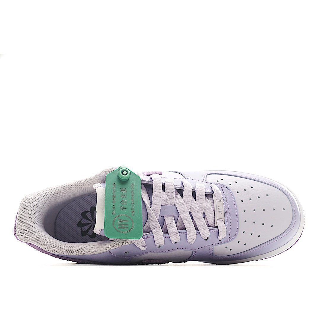 Lavender low-top sneaker interior view with white laces and green-tinted hang tag
