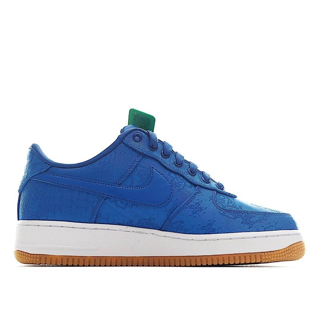 Blue Nike low-top sneaker with lace-up front, white sole, and gum rubber outsole.