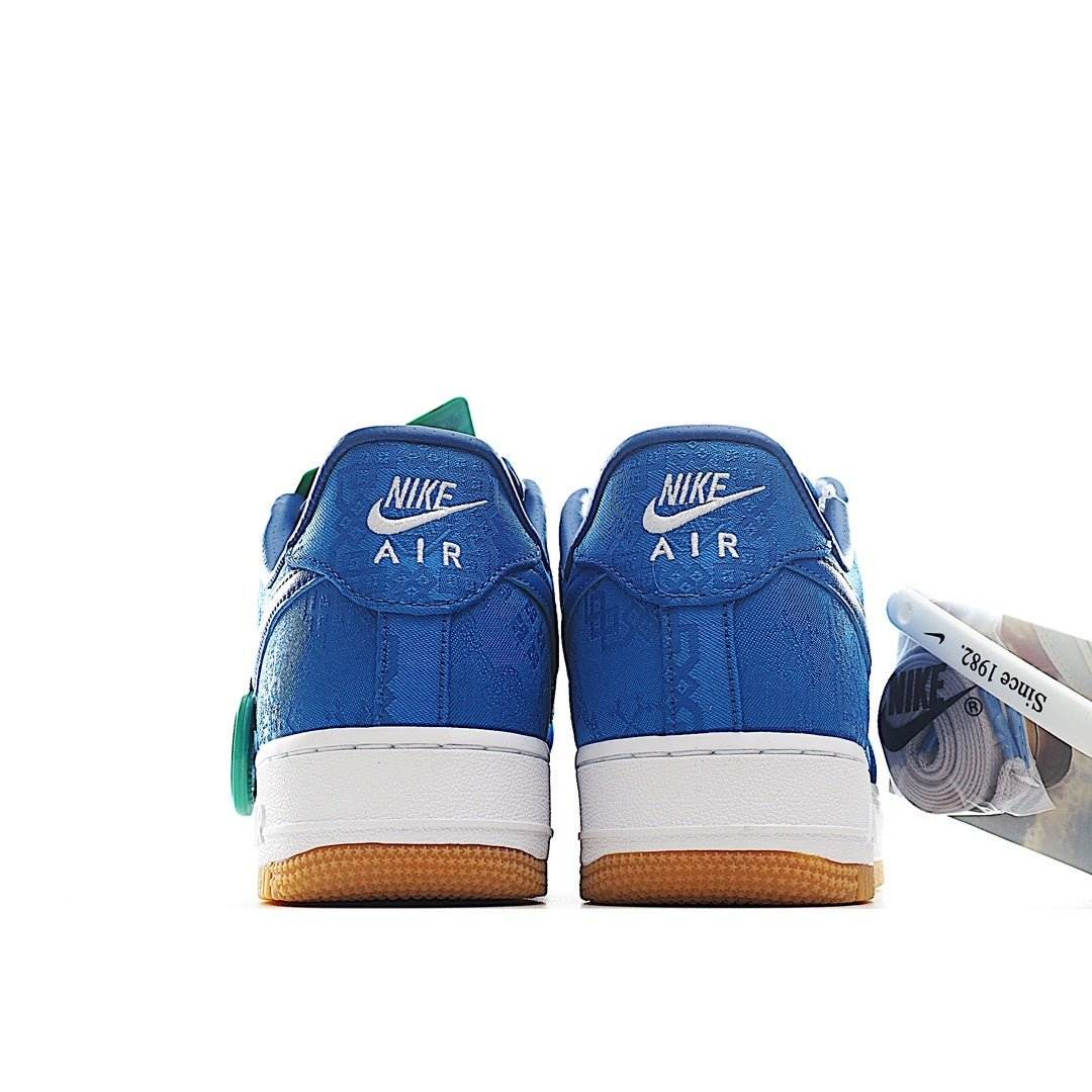 Blue Nike Air sneakers with AIR heel logo, white midsoles, and gum outsole.