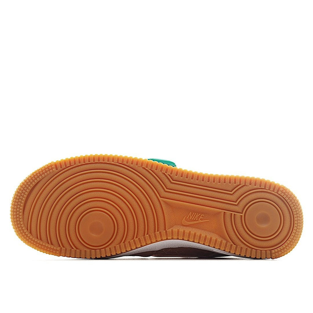 Gum rubber outsole for pink Nike Air Force 1 sneaker with tread pattern