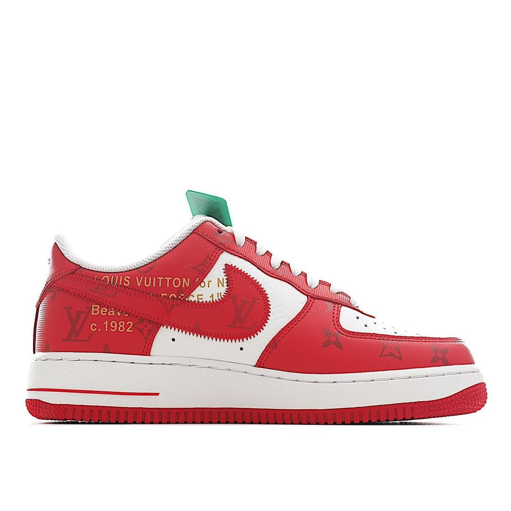 Red and white sneakers with swoosh-style side panel and green ankle tag.