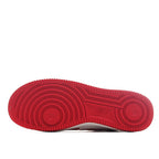 Red sneaker outsole with textured tread pattern.