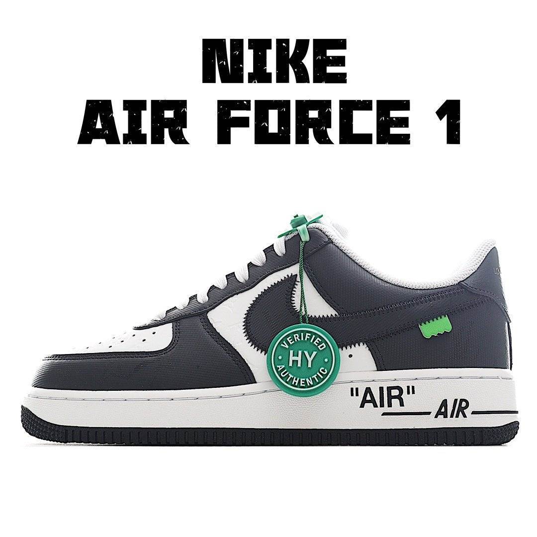 Low-top sneaker with dark navy and white panels, green lace tag, black swoosh