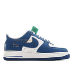 Air Force 1 sneakers in blue and white with green lace tag and swoosh