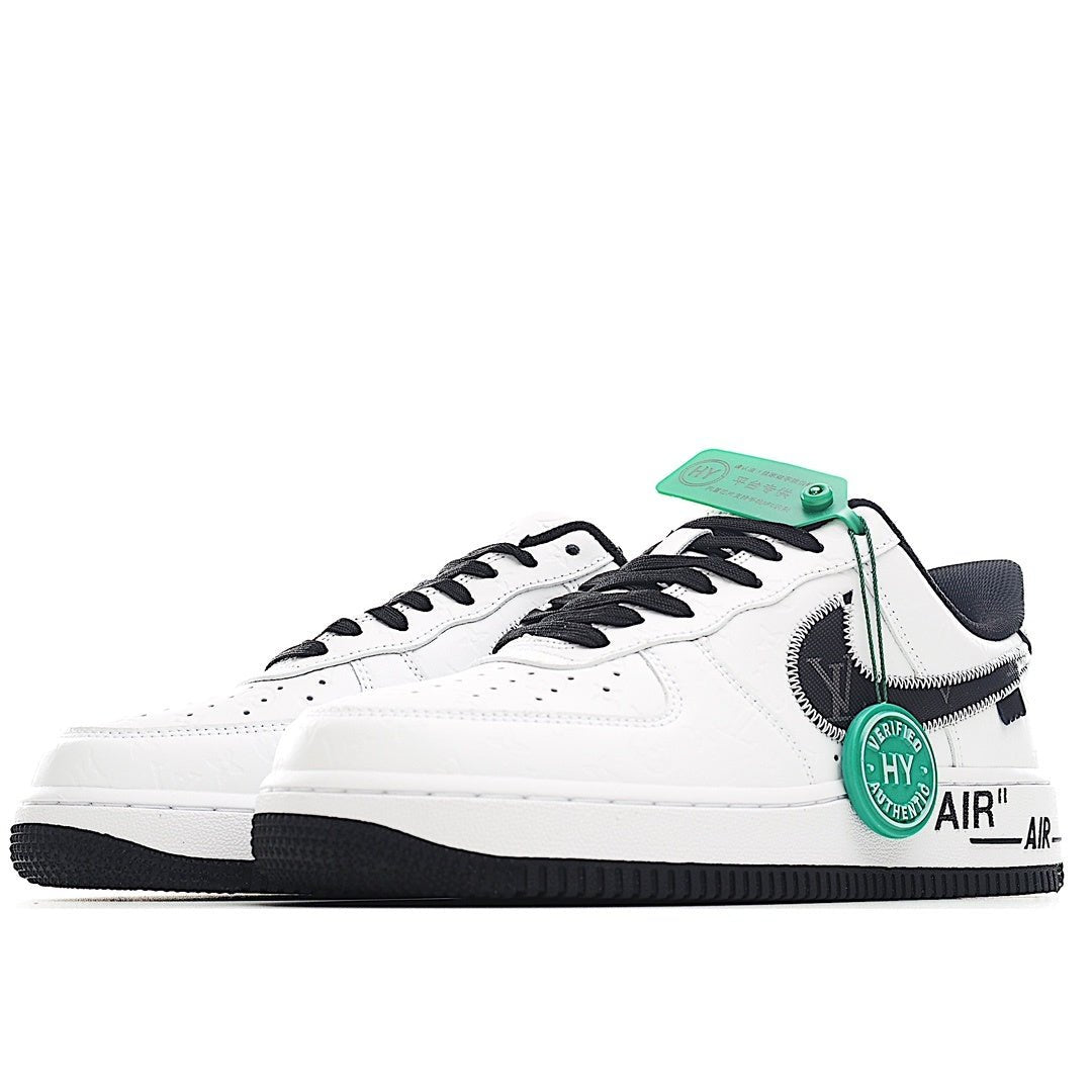 Air Force 1 sneakers, white leather with black laces and green accent at the side