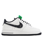 Air Force 1 sneakers, white upper with black swoosh detail and green hangtag