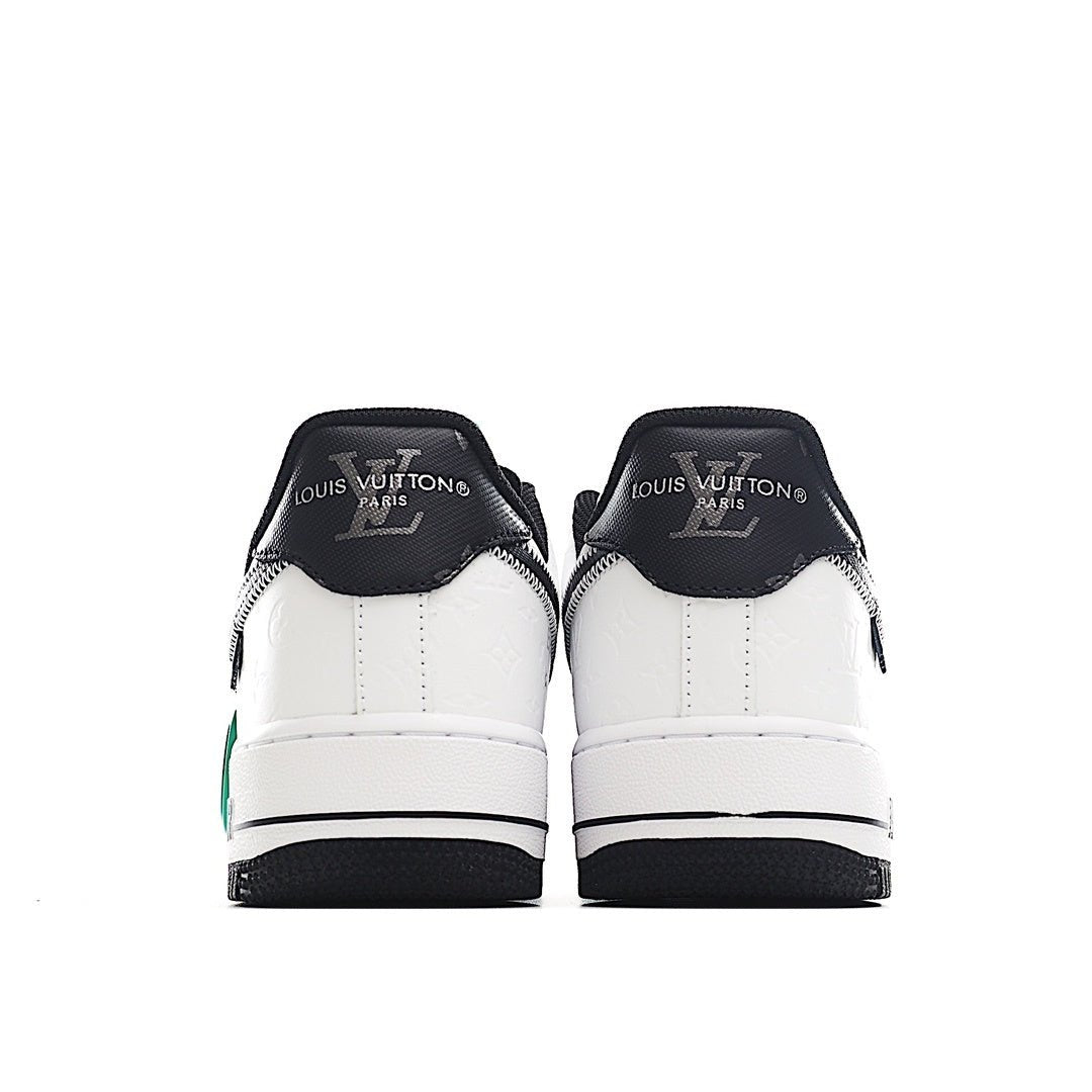 Air Force 1 sneakers, back view with white uppers, black heel counters, green trim
