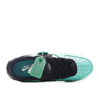 Nike Air Force 1 low-top sneakers, teal and white upper with black toe and heel, tag on