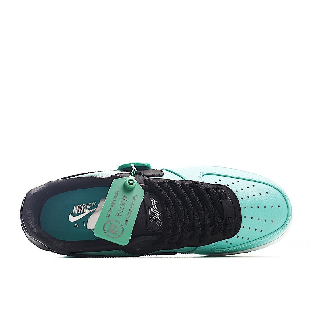 Nike Air Force 1 low-top sneakers, teal and white upper with black toe and heel, tag on