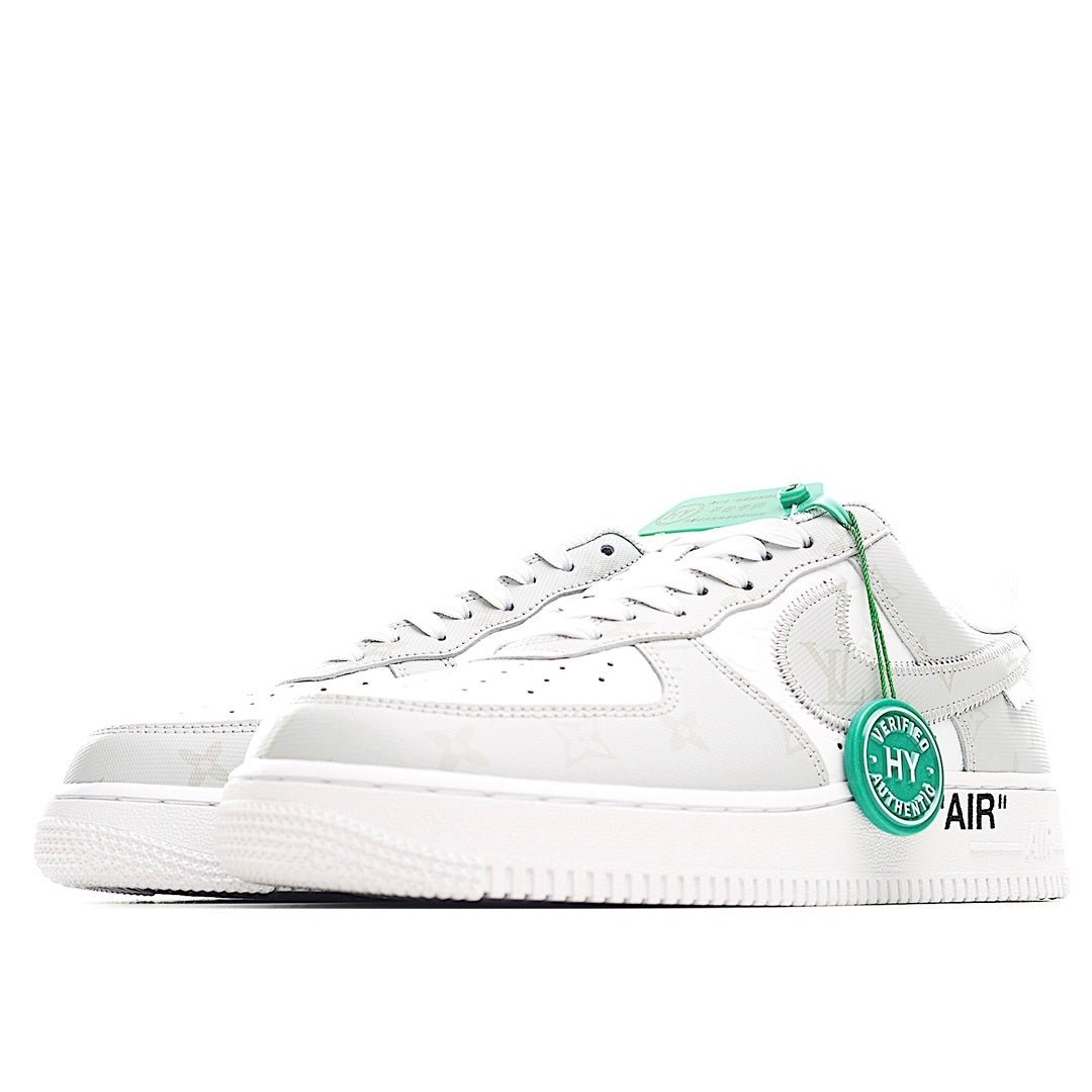White Nike Air Force 1 low-top sneaker with green lace tag and AIR detail