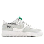 White Nike Air Force 1 low-top sneaker with Louis Vuitton text on upper