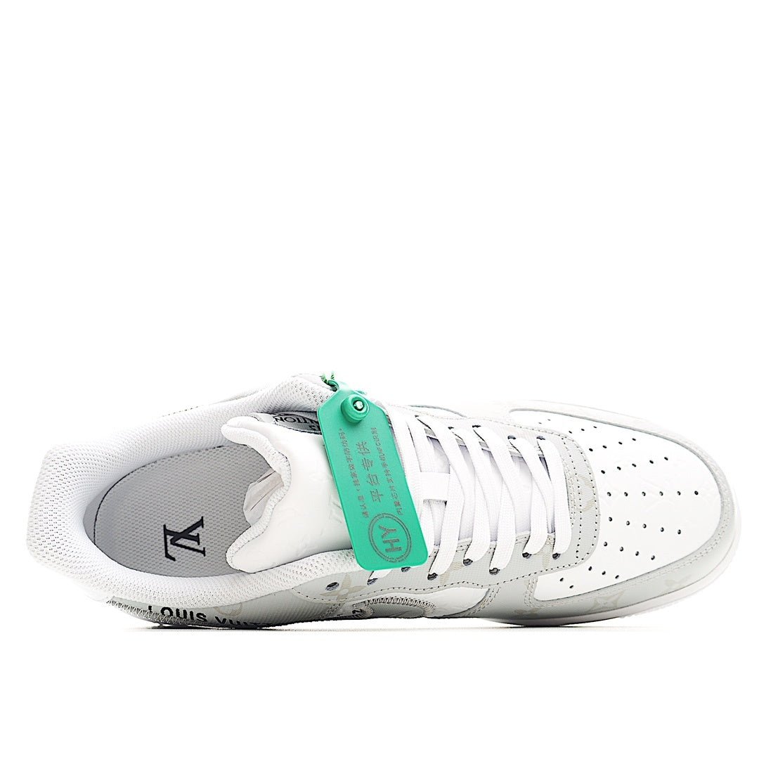 White Nike Air Force 1 low-top sneaker with green tongue tag and Y emblem