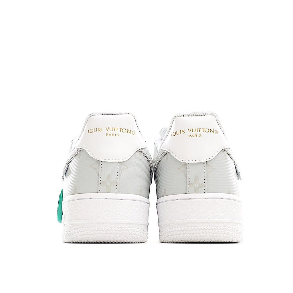 White Nike Air Force 1 low-top sneaker with Louis Vuitton branding on heel tabs