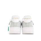 White Nike Air Force 1 low-top sneaker with Louis Vuitton branding on heel tabs