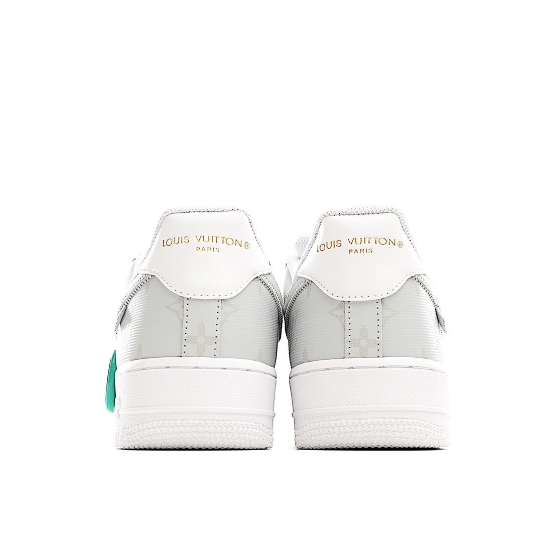 White Nike Air Force 1 low-top sneaker with Louis Vuitton branding on heel tabs
