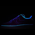 Dark blue Nike Air Force 1 low-top sneaker with neon blue glowing swoosh