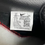 Nike Air Force 1 sneaker size label with barcode on dark upper