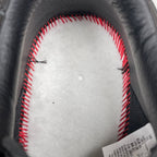 Sneaker interior with white lining and red contrast stitching, dark leather edge