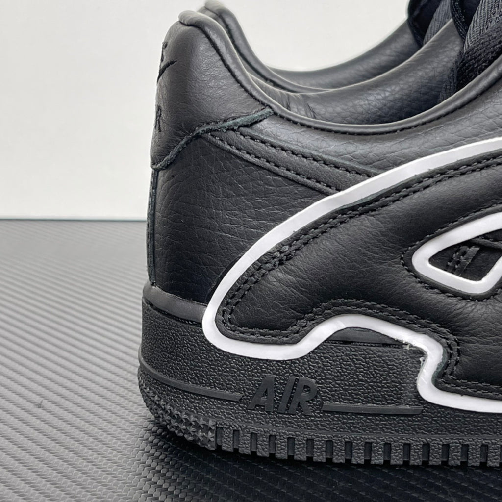 Black leather sneaker heel with stitched overlay, white trim, and AIR logo.