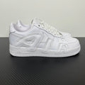 Nike Air Force 1 low-top sneakers in white leather with lace-up front and side overlays.