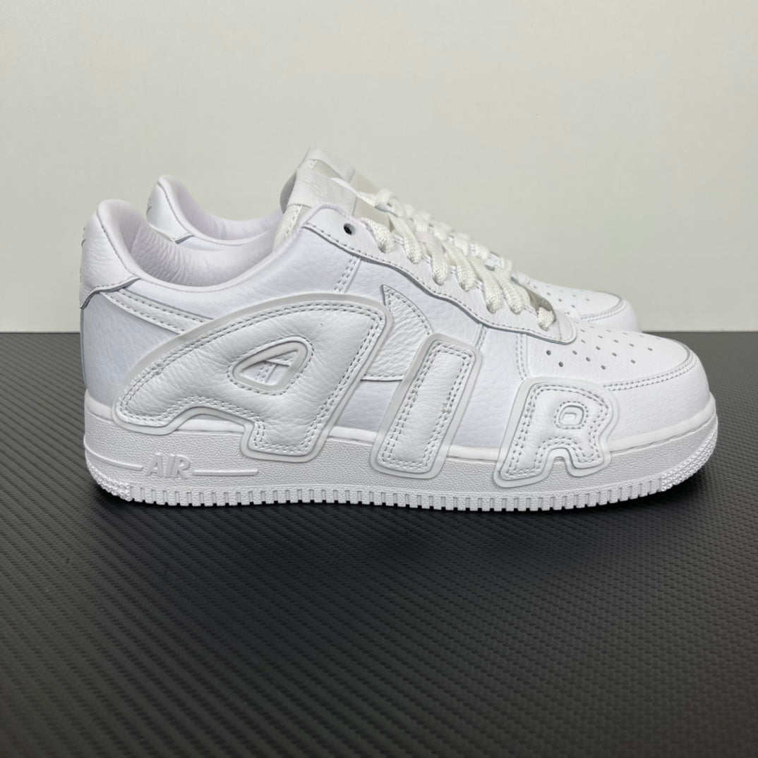 Nike Air Force 1 low-top sneakers in white leather with lace-up front and side overlays.