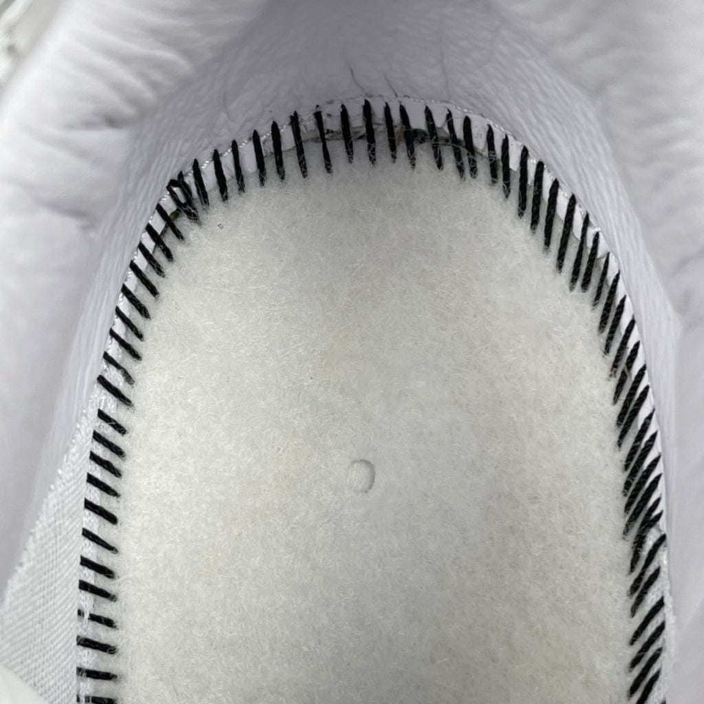 White sneaker outsole with black tread pattern