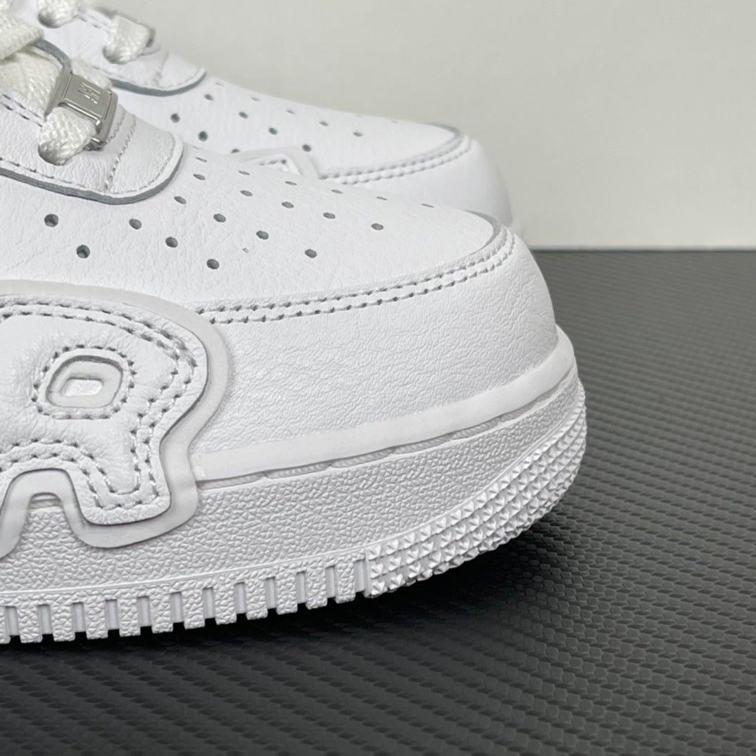 White leather sneaker upper detail with laces, stitched panel, and textured rubber sole edge.