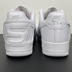 White leather sneaker pair from the heel, showing strap details and Nike Air branding.