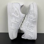 White leather sneakers shown from the side with chunky tread sole and strap-like overlays.