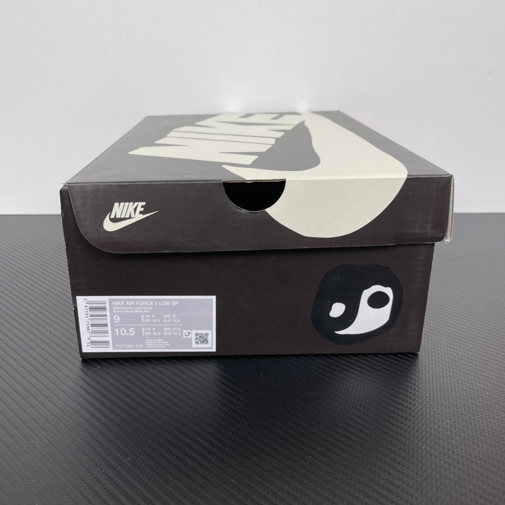 Nike Air Force 1 shoe box with swoosh logo and playful face graphic